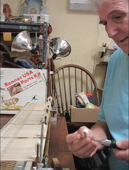 Jeremy Duckles preparing a piano hammer during restoration work.